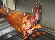 Lamb being spit roasted
